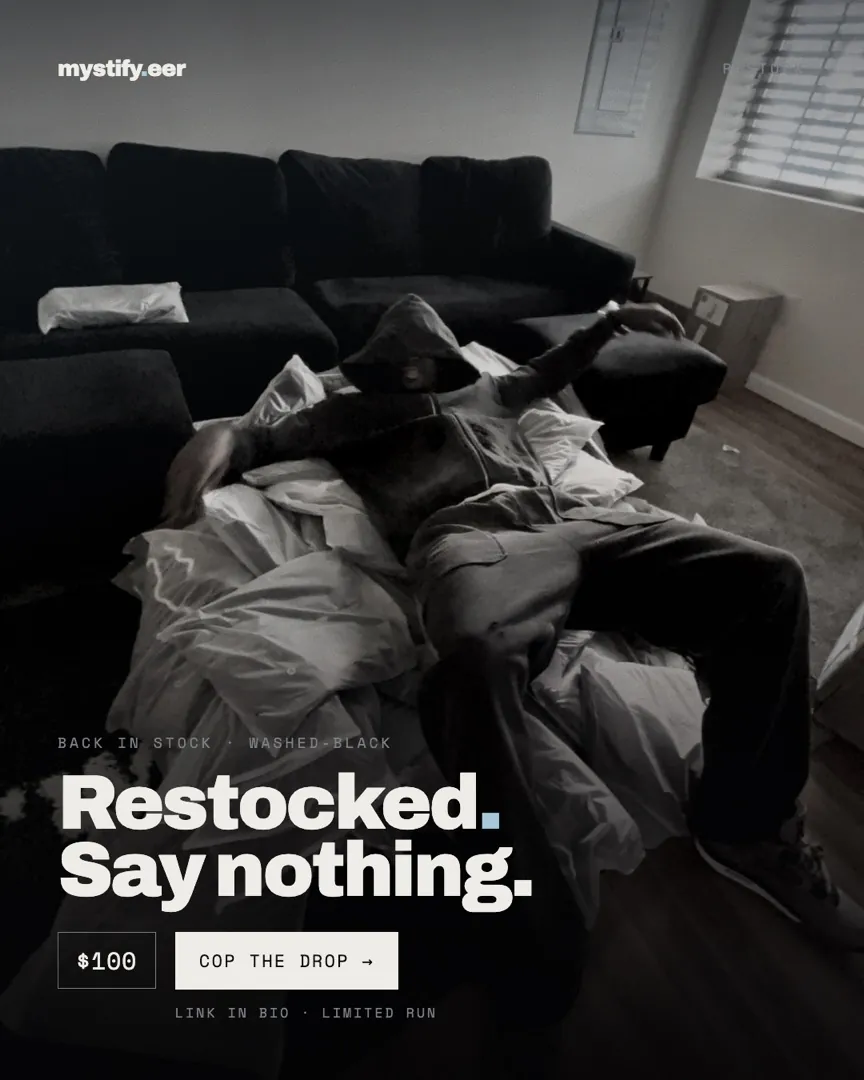 A model reclining across a sofa in washed-black, headlined Restocked. Say nothing.